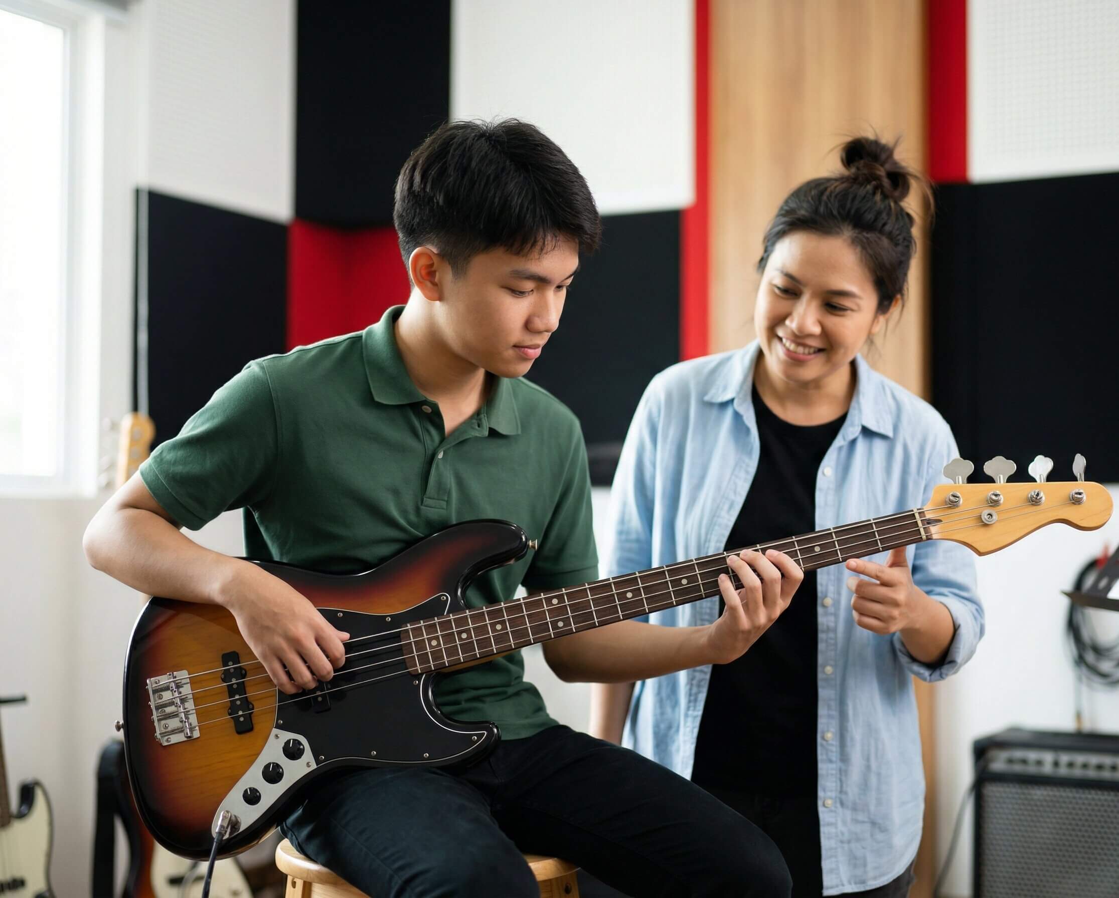 Student learning bass guitar